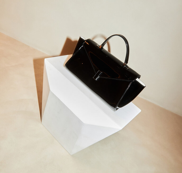 Valextra Iside editor front flap bag in shiny black leather