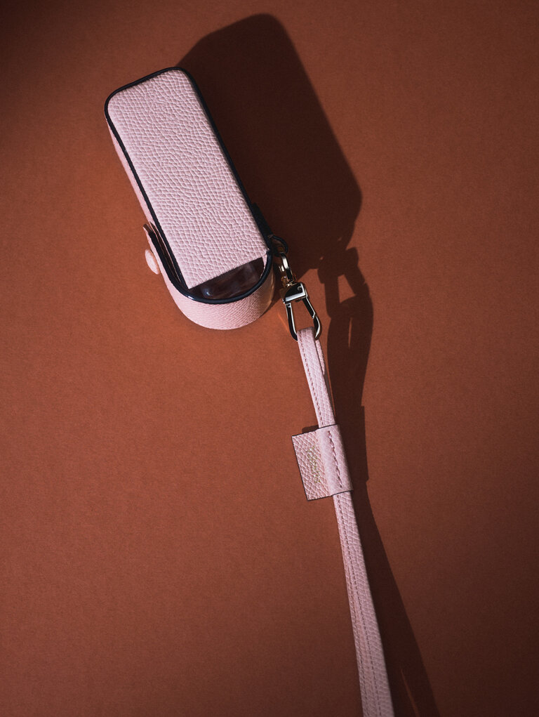 Valextra leather lipstick holder with neck strap, a luxury leather accessory designed for everyday essentials.