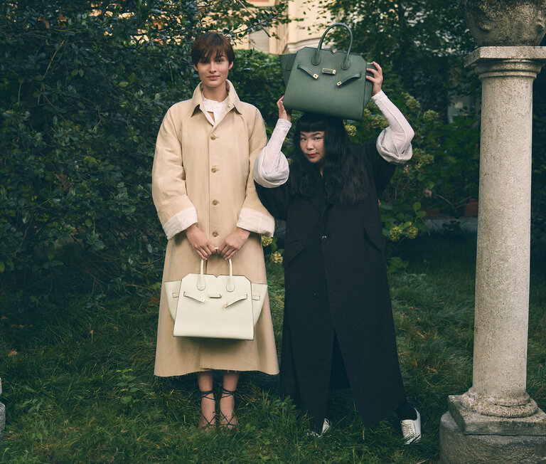 Two girls with handbags