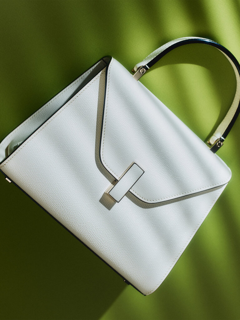White Valextra Iside leather handbag, an iconic women's luxury handbag crafted in Italy.