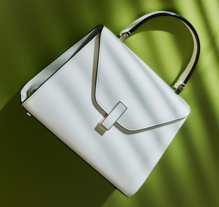 White Valextra Iside leather handbag, an iconic women's luxury handbag crafted in Italy.