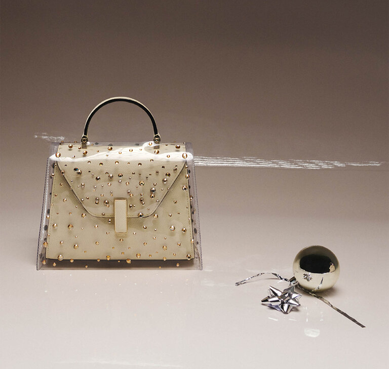 Valextra Iside top handle Bag in white Pergamena with rhinestone raincoat