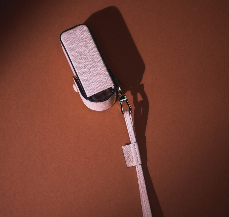 Valextra leather lipstick holder with neck strap, a luxury leather accessory designed for everyday essentials.