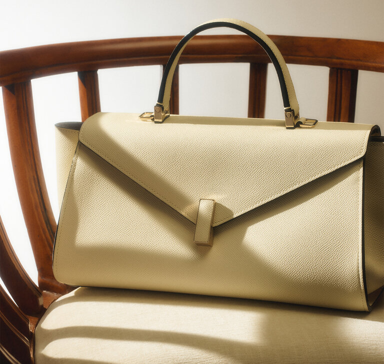 lextra Iside leather handbag in pergamena white ivory, the Maison's iconic Made in Italy handbag.