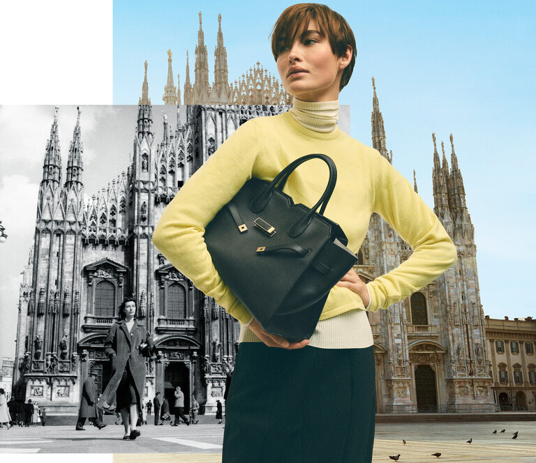 One model with a black bag in front of Milnao Dome